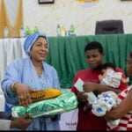 The Wife of Abia Governor, Mrs Priscilla Otti presenting some items to rural women during campaign against Malaria