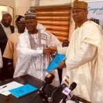 The outgoing Director General, Dr. Nasir Olaitan Raji-Mustapha, and the incoming Director General, Hon. Baffa Babba Dan Agundi, at the handing over ceremony