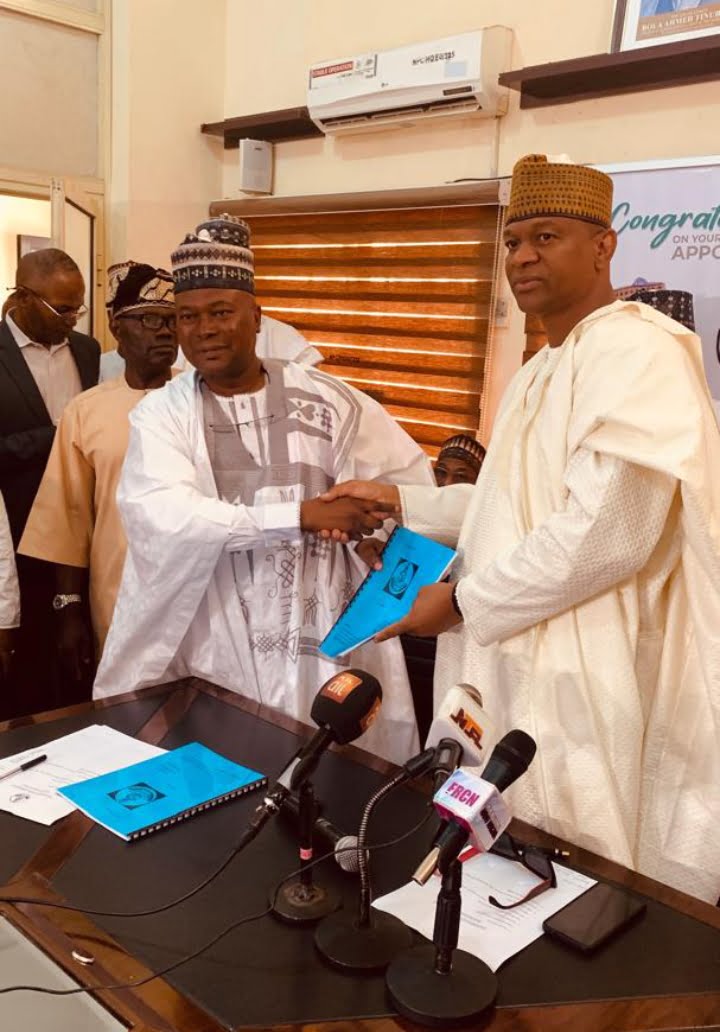 The outgoing Director General, Dr. Nasir Olaitan Raji-Mustapha, and the incoming Director General, Hon. Baffa Babba Dan Agundi, at the handing over ceremony