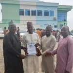 Caretaker Committee Chairman of Kogi LGC, Hon Musa Abdulmalik (M) in a group photograph with some APC stakeholders from Kogi LG shortly after picking his chairmanship nomination forms at APC State secretariat Lokoja on Tuesday