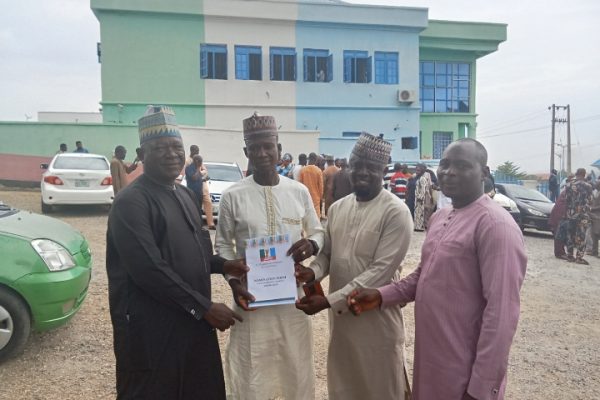Caretaker Committee Chairman of Kogi LGC, Hon Musa Abdulmalik (M) in a group photograph with some APC stakeholders from Kogi LG shortly after picking his chairmanship nomination forms at APC State secretariat Lokoja on Tuesday
