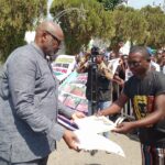 Secretary to the State Government, SSG, Dr Kingsley Emu receiving letter of protesters