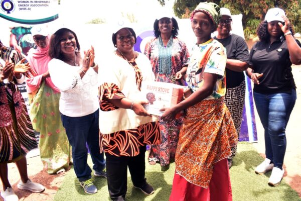 The National Vice President, Women in Renewable Energy -Associations (WIRE-A)Dr. Anita Adeyemi making a presentation to one of the recipients of the Cookstoves at the occasion. Lined up behind her (from left to right)are: National Secretary- Rashida Mahmood, FCT Coordinator - Dr. Adetoun Dally, Kaduna State Coordinator - Vivienne Uzo Iyiegbu, South East Regional Coordinator - Hon. Bridget Obi and Head of Clean Cookstoves- Chibuzor Chidozie .M