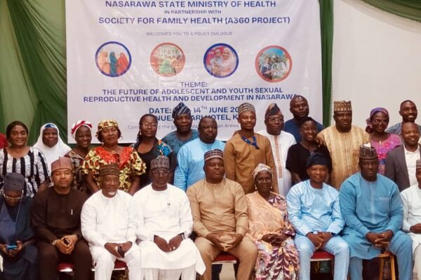 Participants at policy dialogue organized by society for family health SFH.