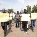Prophet Isa El-Buba (m) with placard alongside some church members during a peaceful protest in Abuja, on Tuesday over Benue killings.