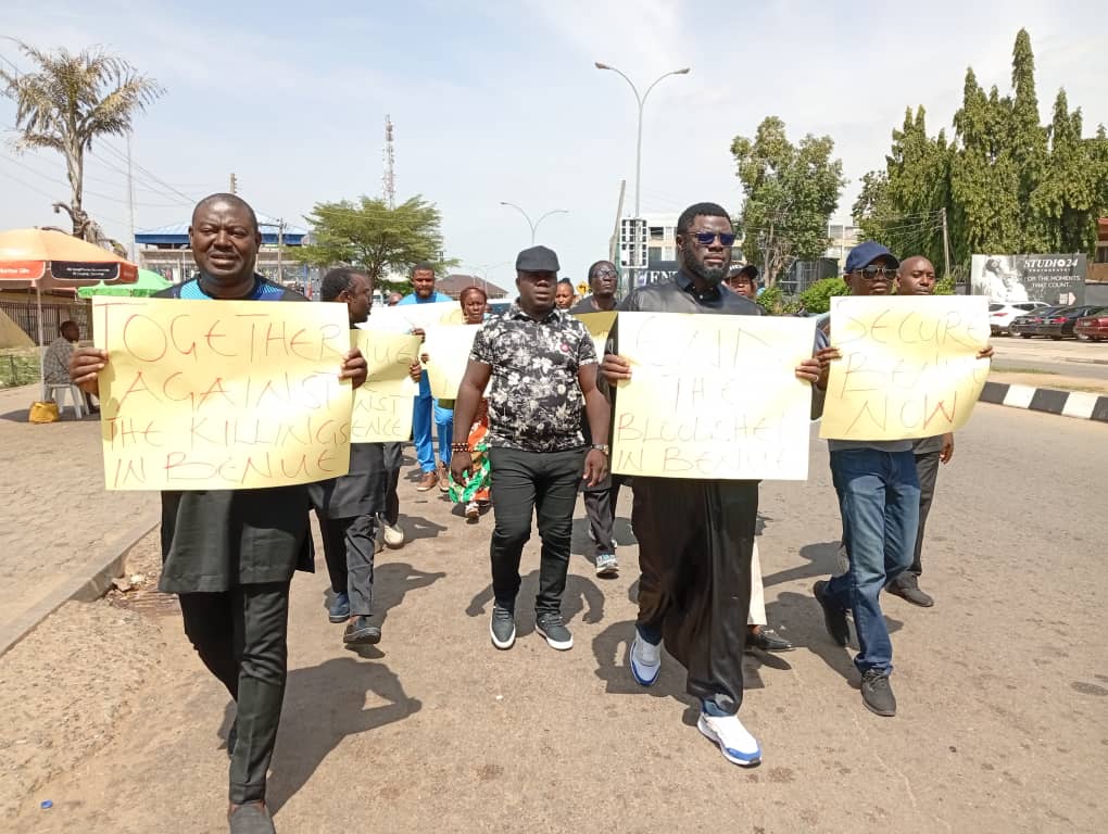 Prophet Isa El-Buba (m) with placard alongside some church members during a peaceful protest in Abuja, on Tuesday over Benue killings.