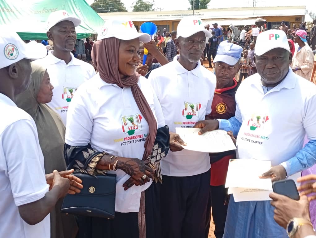 The Abaji area council chapter chairman of the YPP Hon Alhassan Suleiman right present letter to the organizing secretary of the party Mohammed Nadaba, shortly after his inauguration in Abaji on Saturday.