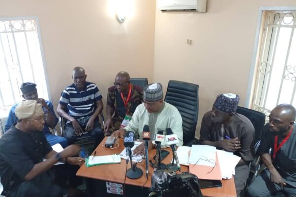 Chairman of the electoral committee of the PDP chairmanship primaries Hon Chris Hassan,(m) while declaring the results at the state party's office in Abuja on Monday.
