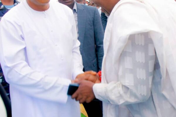 Kogi State Governor, HE Ahmed Usman Ododo (L) in a handshake with Chief Richard Asaje (R)