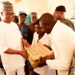 Chairman of Kokona LGC Agbawu Mek Agbawu, presenting Hospital consumables to medical officers