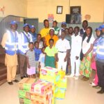 The Coordinator of the Kpuchum Care Initiative, Mr. Geoffrey Babale and other members of the Organization in a group photograph with the Orphans and the items presented to them.