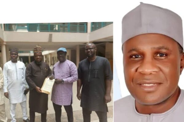 Ubaine Youth Association (L), Minister of Regional Development Engr. Abubakar Momoh (R)