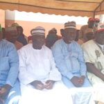 YPP chairman Alhaji Alhassan Suleiman present flag to former speaker of Abaji during his defection to YPP on Tuesday.