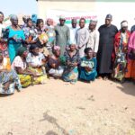Mr. Theophilus Peter Ewu in a group photograph with other dignitaries and beneficiaries.