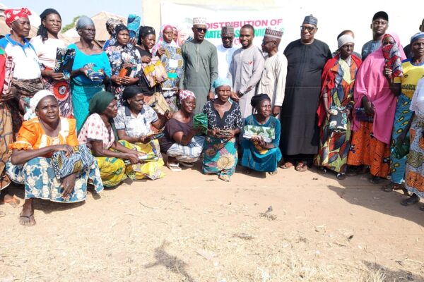 Mr. Theophilus Peter Ewu in a group photograph with other dignitaries and beneficiaries.