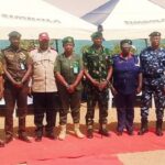 Some officers and men of corrections with sisters federal government security agencies in a group photograph.