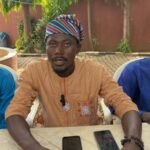 President of the Abuja Indegeneous Students Association (AISA) Comrade Aliyu Hamza (m) address newsmen in Abuja on Wednesday.