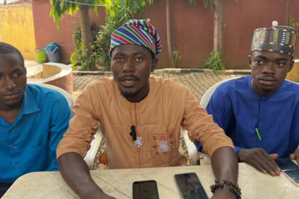 President of the Abuja Indegeneous Students Association (AISA) Comrade Aliyu Hamza (m) address newsmen in Abuja on Wednesday.