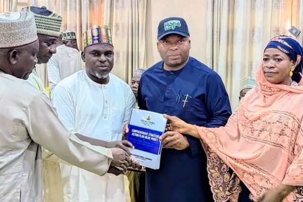 Action planning committee chairman Prof Mohammed Ibrahim Evuti present report to the chairman -elect of Kuje Area Council on Thursday