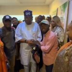 Hon. James Abiodun Faleke and Hon. Gabriel Joshua Ojochebe display specially branded Tinubu emblem footwear during ANCY's courtesy visit in Abuja.