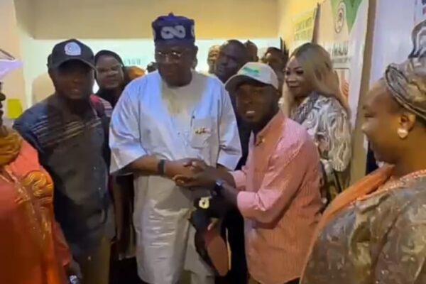 Hon. James Abiodun Faleke and Hon. Gabriel Joshua Ojochebe display specially branded Tinubu emblem footwear during ANCY's courtesy visit in Abuja.