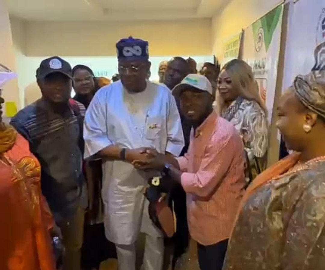 Hon. James Abiodun Faleke and Hon. Gabriel Joshua Ojochebe display specially branded Tinubu emblem footwear during ANCY's courtesy visit in Abuja.