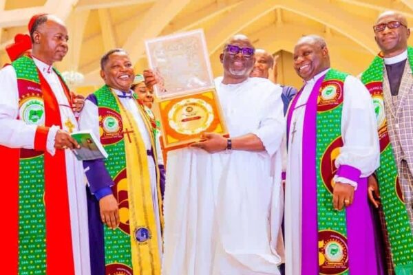 Funkekeme Solomon congratulates Governor Sheriff Oborevwori on his Christian Icon Award.